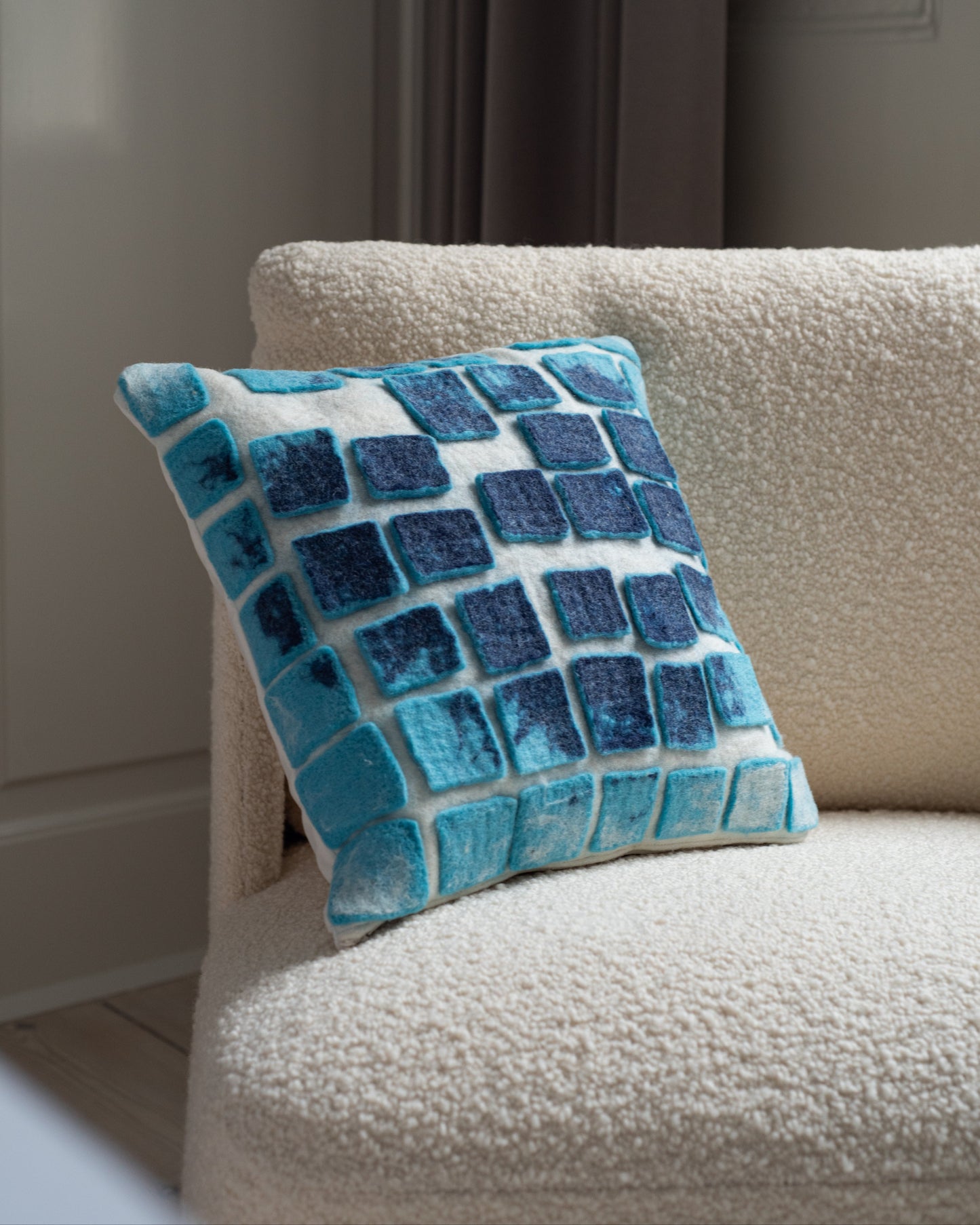 Handmade felted wool cushion with blue grid design - The Tuftista