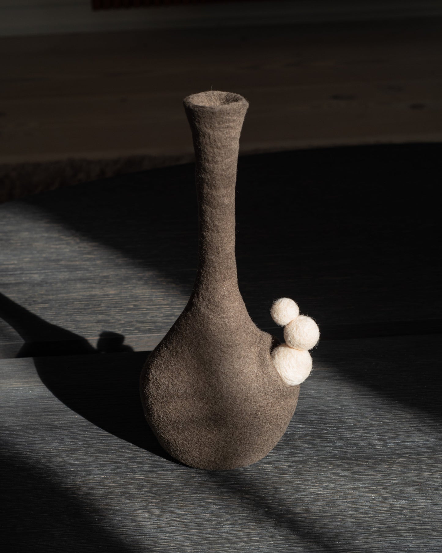 Felted wool vase in natural tones on wooden table - The Tuftista