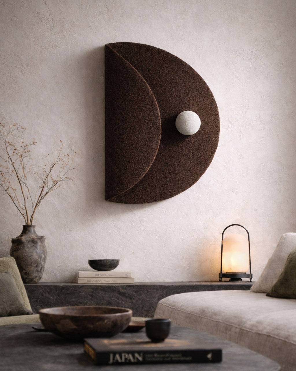 Minimalist Japandi living room with sculptural wool wall art creating calm and depth