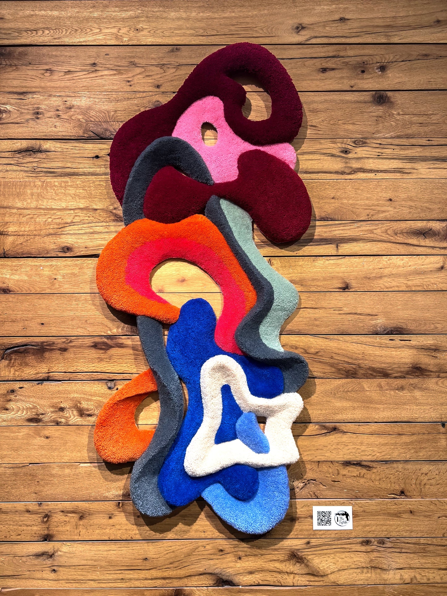 3D wool wall sculpture with layered curves and light play. - The Tuftista