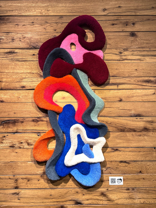 3D wool wall sculpture with layered curves and light play. - The Tuftista